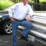 Grandpa in trucking gear aside white truck (2)